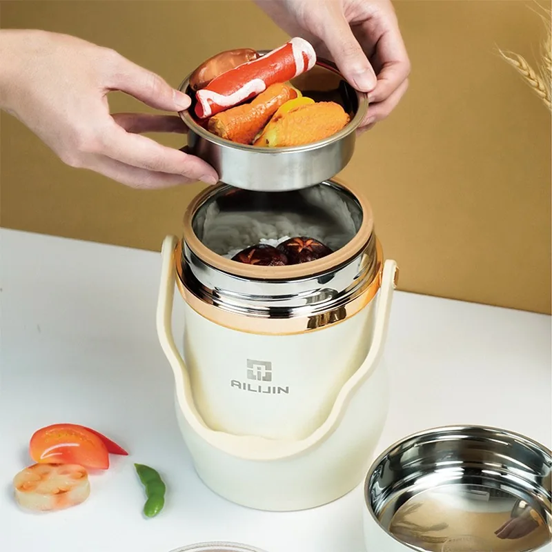 Hộp cơm nhiều tầng mở ra để thấy c&aacute;c khay chứa thực phẩm