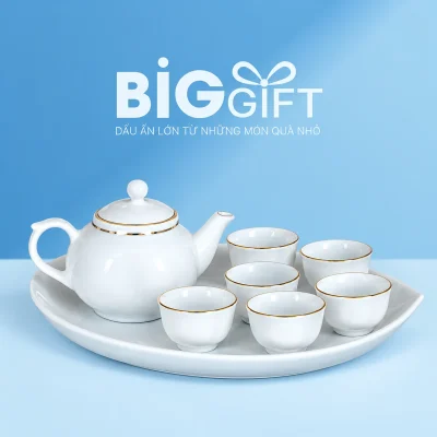 Bộ trà khay đào men trắng viền màu vàng với một ấm và sáu chén trên nền BigGift