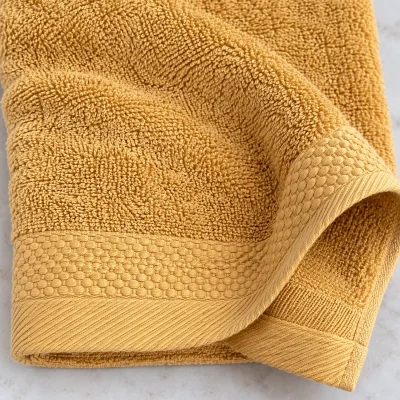 Khăn tắm Cotton 70 × 140 cm màu vàng – chi tiết vòng sợi, băng dệt và đường mép