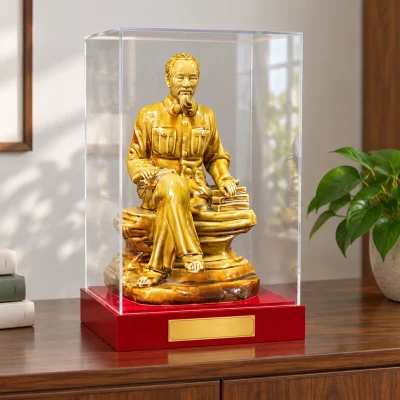 Tượng Bác Hồ ngồi đọc sách men vàng nâu – bố trí trong góc đọc sách có khoảng trống